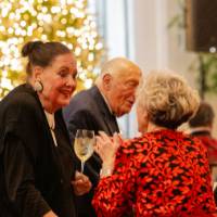 Dottie Johnson speaking with other guest at party